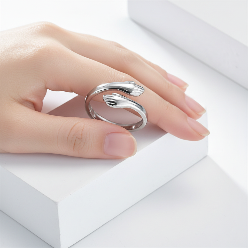 The Embrace Ring worn on finger - front view