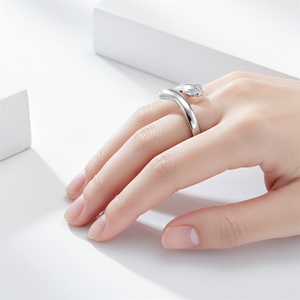 The Embrace Ring worn on finger - side angle